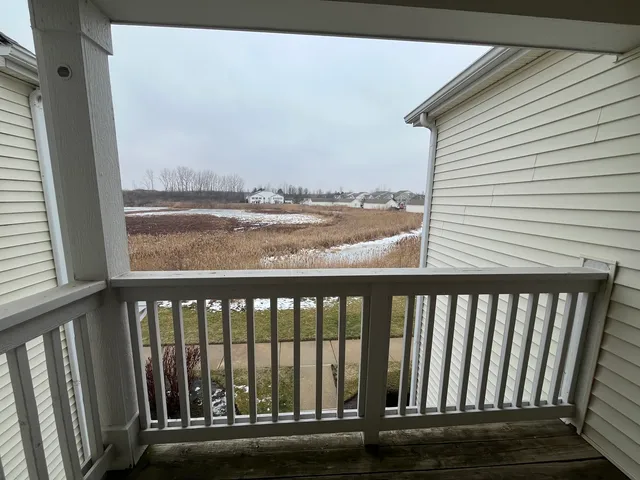 a view of a balcony with an outdoor space