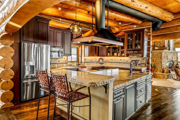 a view of a patio with table and chairs with wooden floor