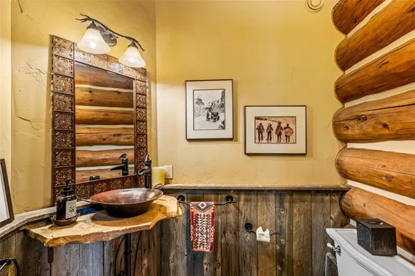 a view of a bathroom with a sink and a mirror