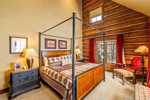 a bed room with a bed and a couch