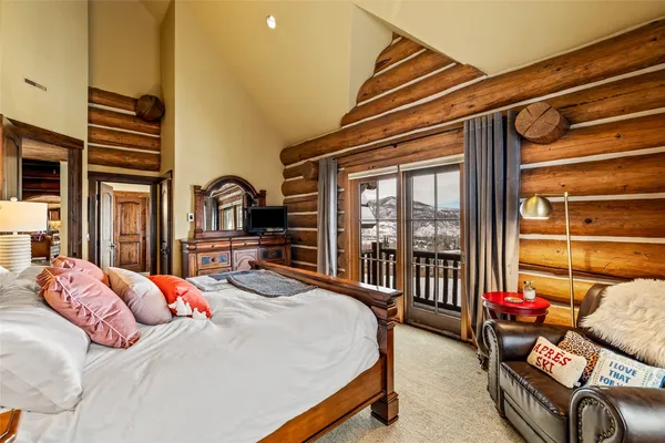 a bedroom with furniture and a window