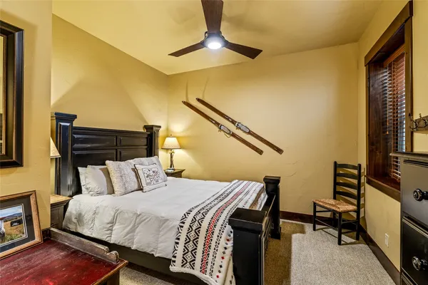 a bedroom with double bed and a window