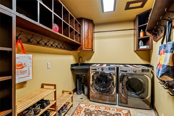 an aerial view of a house with a yard and sitting area