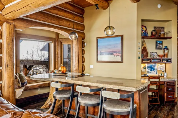 a dinning table and chairs in a room