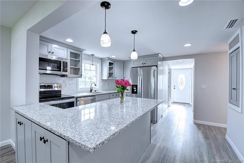 GRANITE KITCHEN AND FRONT ENTRANCE