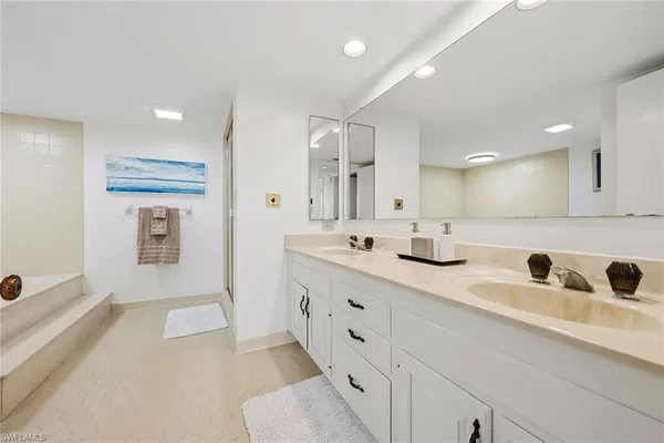 a bathroom with a tub and shower