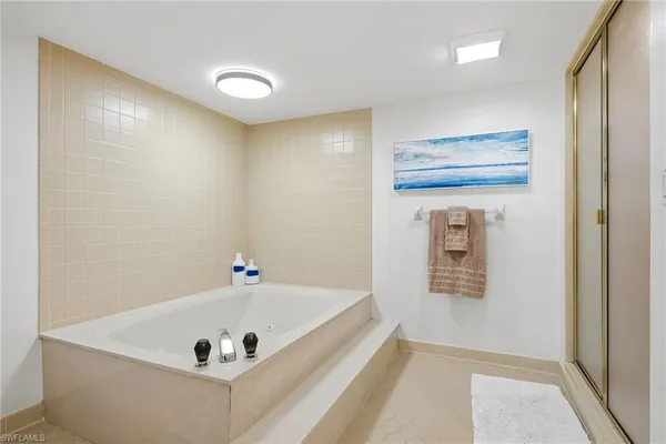 a bathroom with a sink a mirror and shower