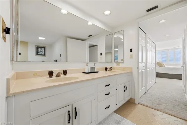 a view of a livingroom with furniture and a potted plant