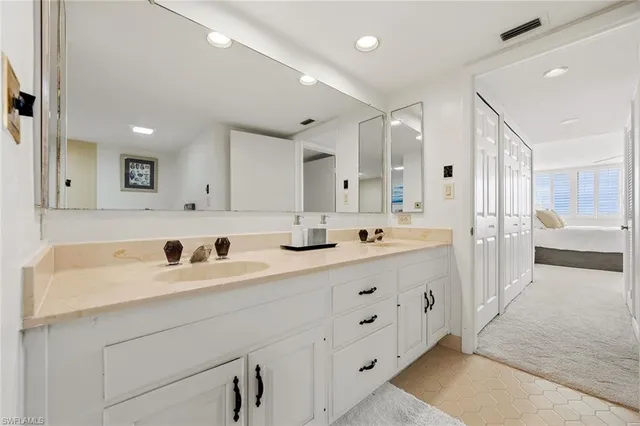 a view of a patio with a table and chairs next to a yard