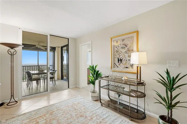 a bedroom with two beds and a large window