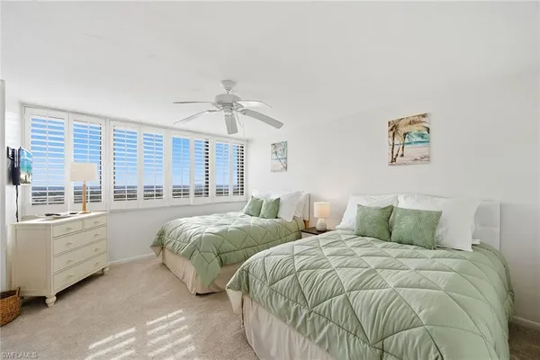 a bedroom with a bed and a lamp