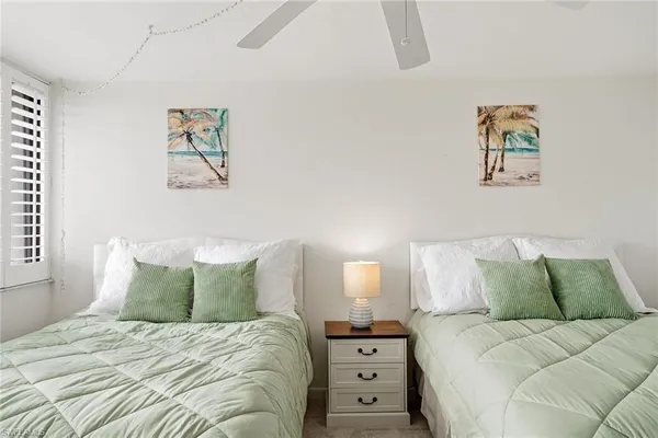 a large white bed in a white room