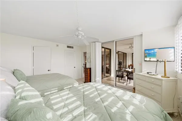 a spacious bathroom with a double vanity sink a mirror and a shower