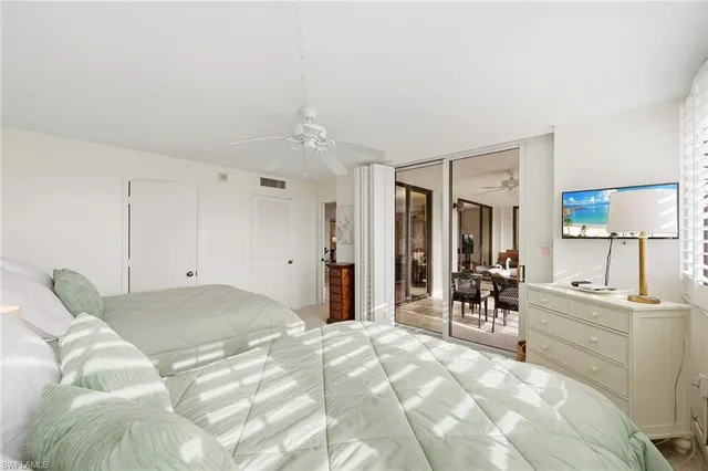 a living room with furniture a large window with wooden floor