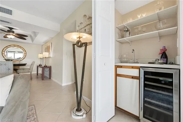 a view of a dining room with furniture and a chandelier