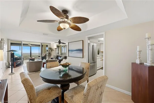 a view of a dining room with furniture and chandelier