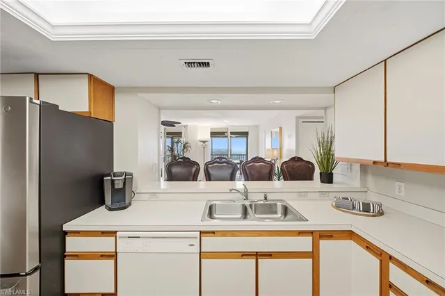 a spacious bedroom with a bed and a flat screen tv