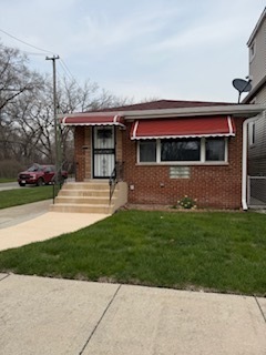 2900 East 101st Street Chicago, IL 60617 - Photo 1 of 27 a front view of house with yard
