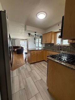 2900 East 101st Street Chicago, IL 60617 - Photo 12 of 27 a kitchen with stainless steel appliances granite countertop a refrigerator and a stove top oven