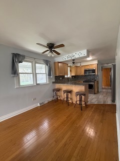 2900 East 101st Street Chicago, IL 60617 - Photo 14 of 27 a view of a room with wooden floor and furniture