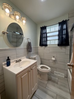 2900 East 101st Street Chicago, IL 60617 - Photo 17 of 27 a bathroom with a sink and a mirror