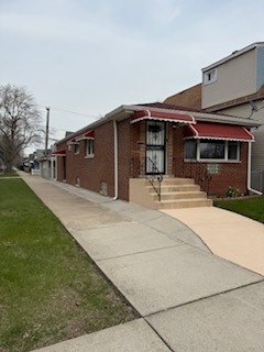 2900 East 101st Street Chicago, IL 60617 - Photo 2 of 27 a front view of a house with a yard