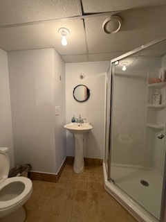 2900 East 101st Street Chicago, IL 60617 - Photo 22 of 27 a bathroom with a sink a toilet and shower
