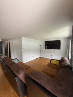 2900 East 101st Street Chicago, IL 60617 - Photo 7 of 27 a bedroom with a bed and a flat screen tv