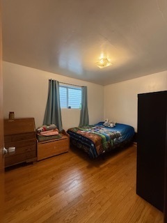 2900 East 101st Street Chicago, IL 60617 - Photo 8 of 27 a bedroom with a bed and window