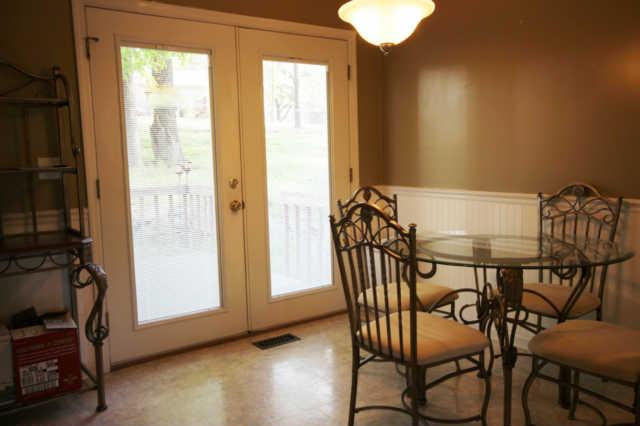 202 Nottingham Road Dickson, TN 37055 - Photo 14 of 20 Dining area has new French doors, with interior blinds, leading out onto the deck for outdoor entertaining.