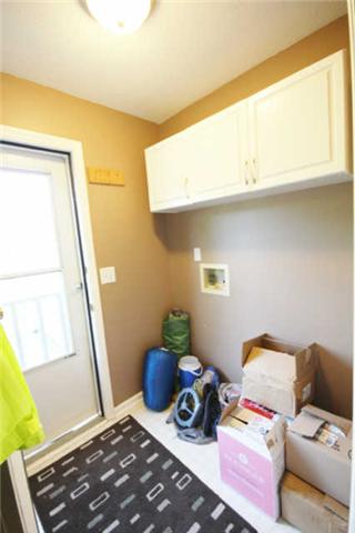 202 Nottingham Road Dickson, TN 37055 - Photo 20 of 20 The utility room has cabinets for storage.