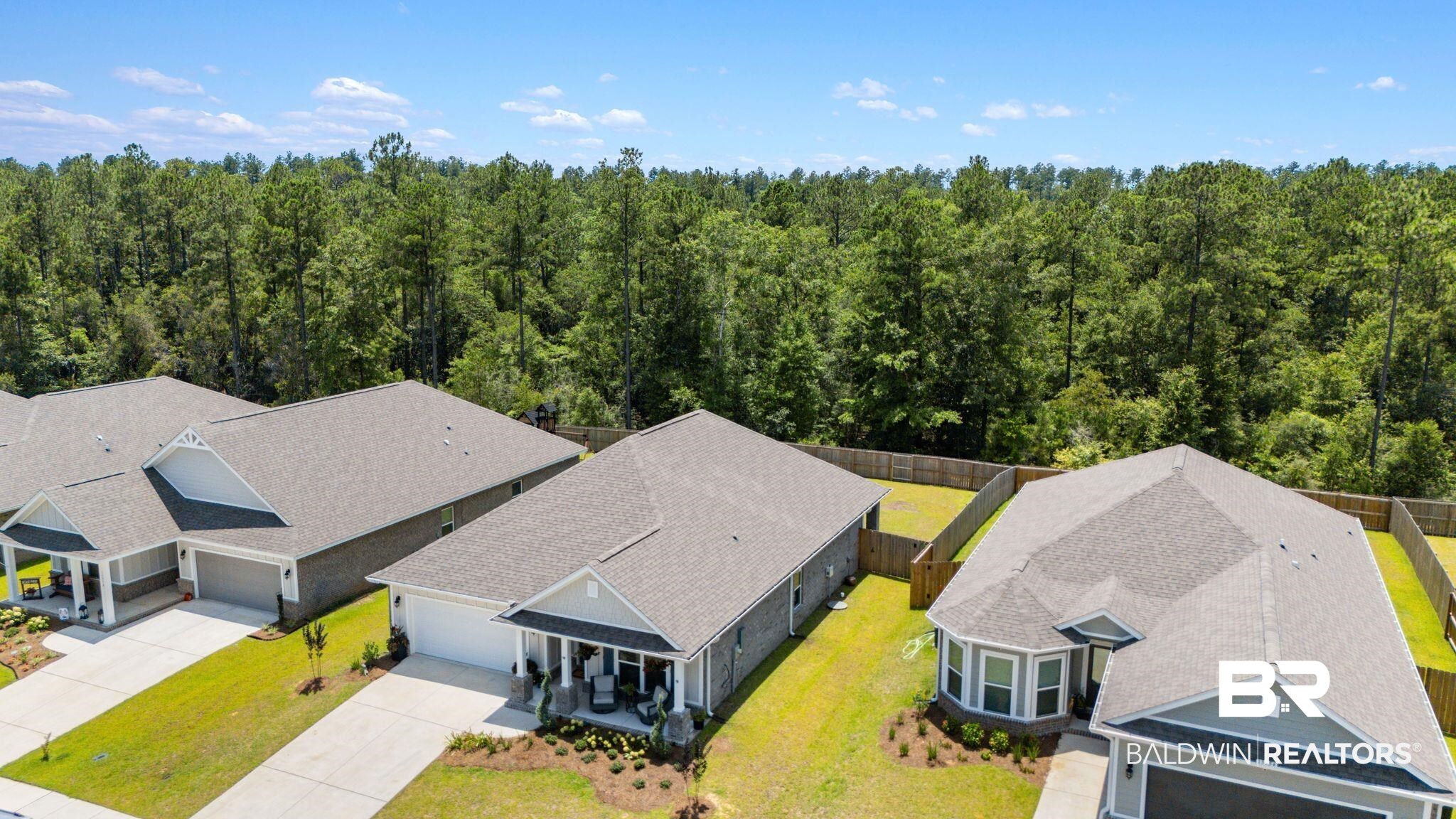 13966 Antler Hl Road Daphne, AL 36527 - Photo 38 of 44 New construction homes featuring gray siding, white trim, attached garages, and fenced backyards