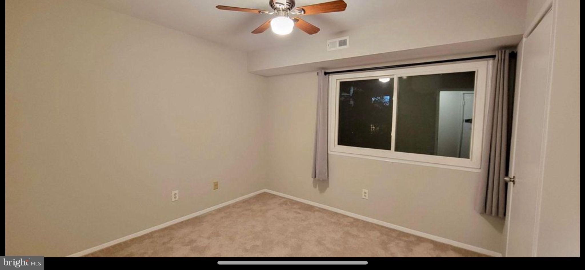 2908 Kings Chapel Road, Unit 3/10 Falls Church, VA 22042 - Photo 7 of 7 a view of a hallway with wooden floor and a ceiling fan
