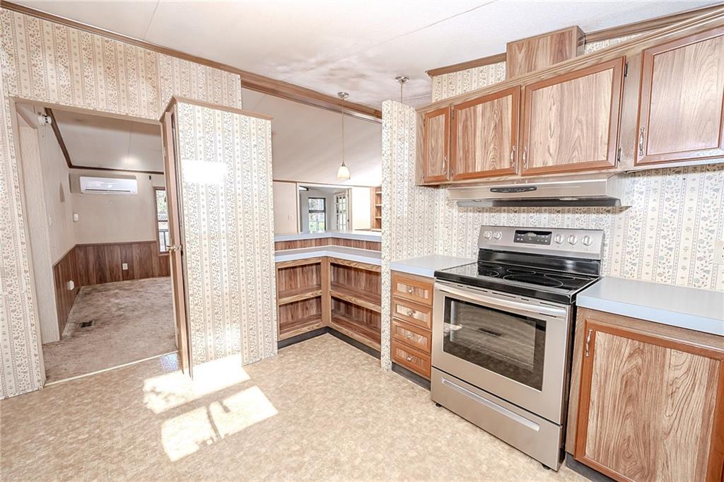 3239 Chestnut Ridge Road Penn Run, PA 15765 - Photo 11 of 29 a kitchen with stainless steel appliances granite countertop a stove and a refrigerator