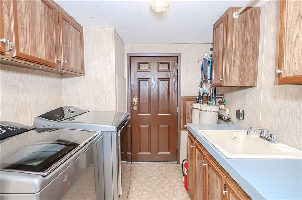 3239 Chestnut Ridge Road Penn Run, PA 15765 - Photo 13 of 29 a kitchen with a sink stove and cabinets
