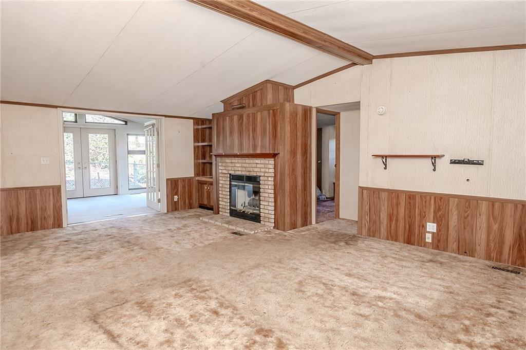 3239 Chestnut Ridge Road Penn Run, PA 15765 - Photo 2 of 29 a view of an empty room with a fireplace and a window