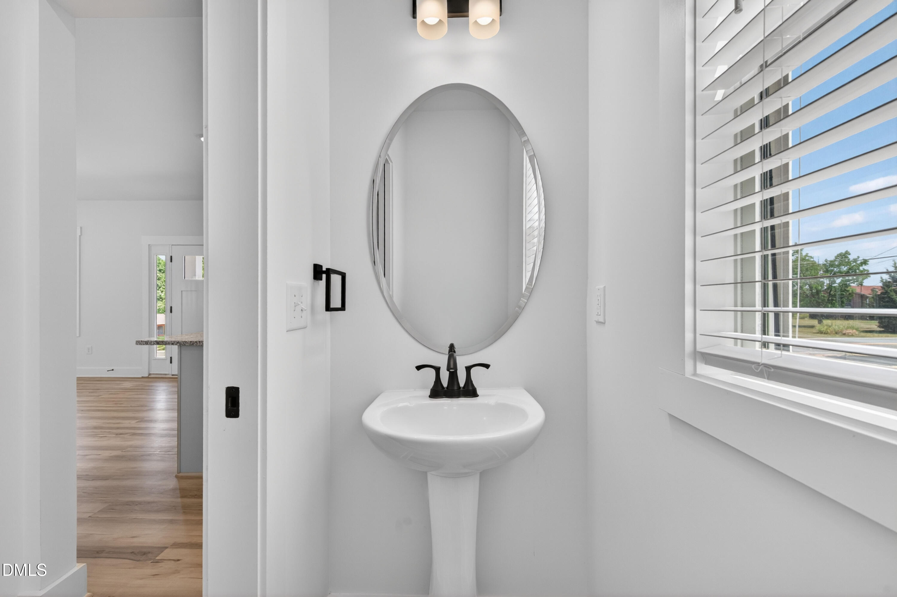 1182 Hurdle Mills Road Roxboro, NC 27573 - Photo 19 of 45 a bathroom with a sink and a mirror