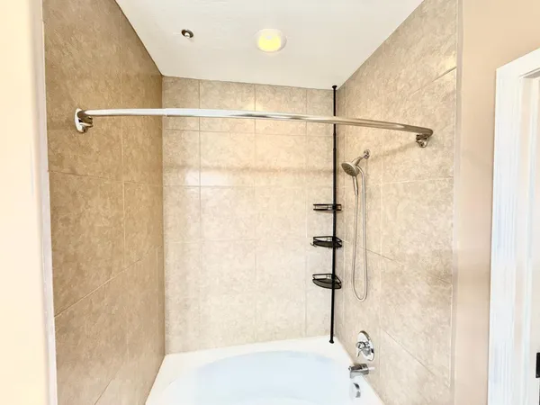 a bathroom with a shower and a sink