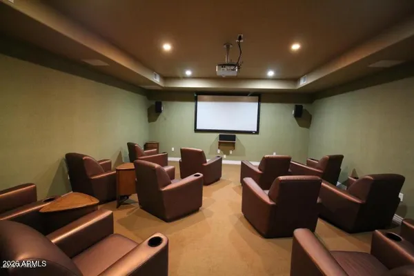 a room with pool table and windows