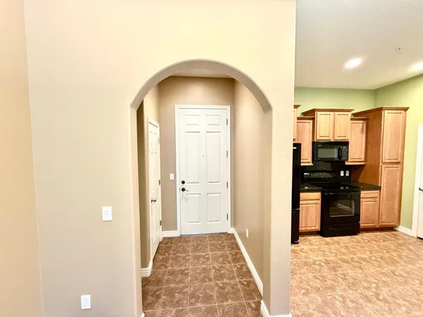 a view of a kitchen from the hallway
