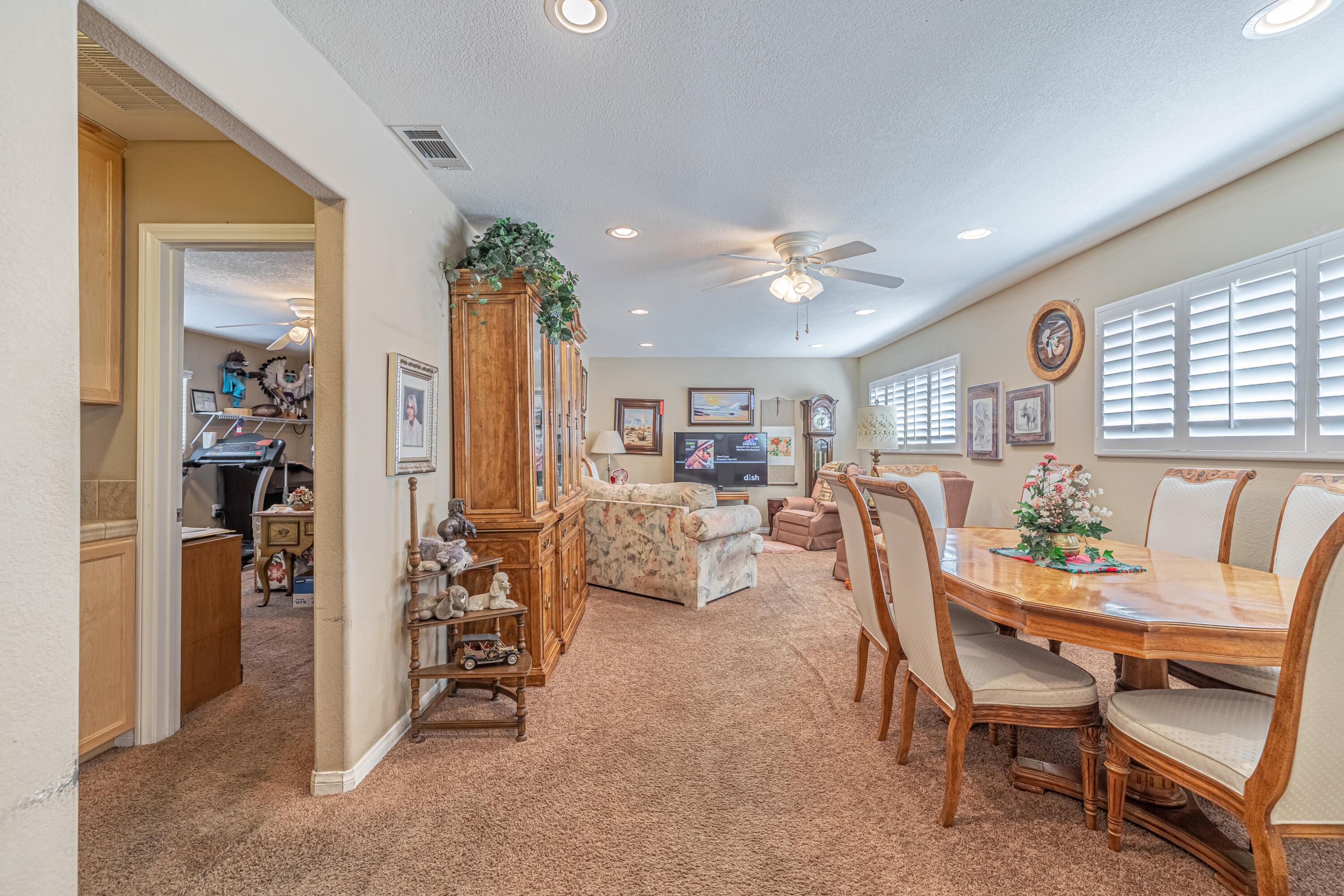 2153 West Ave K8 Lancaster, CA 93534 - Photo 13 of 31 a dining room with furniture and a window