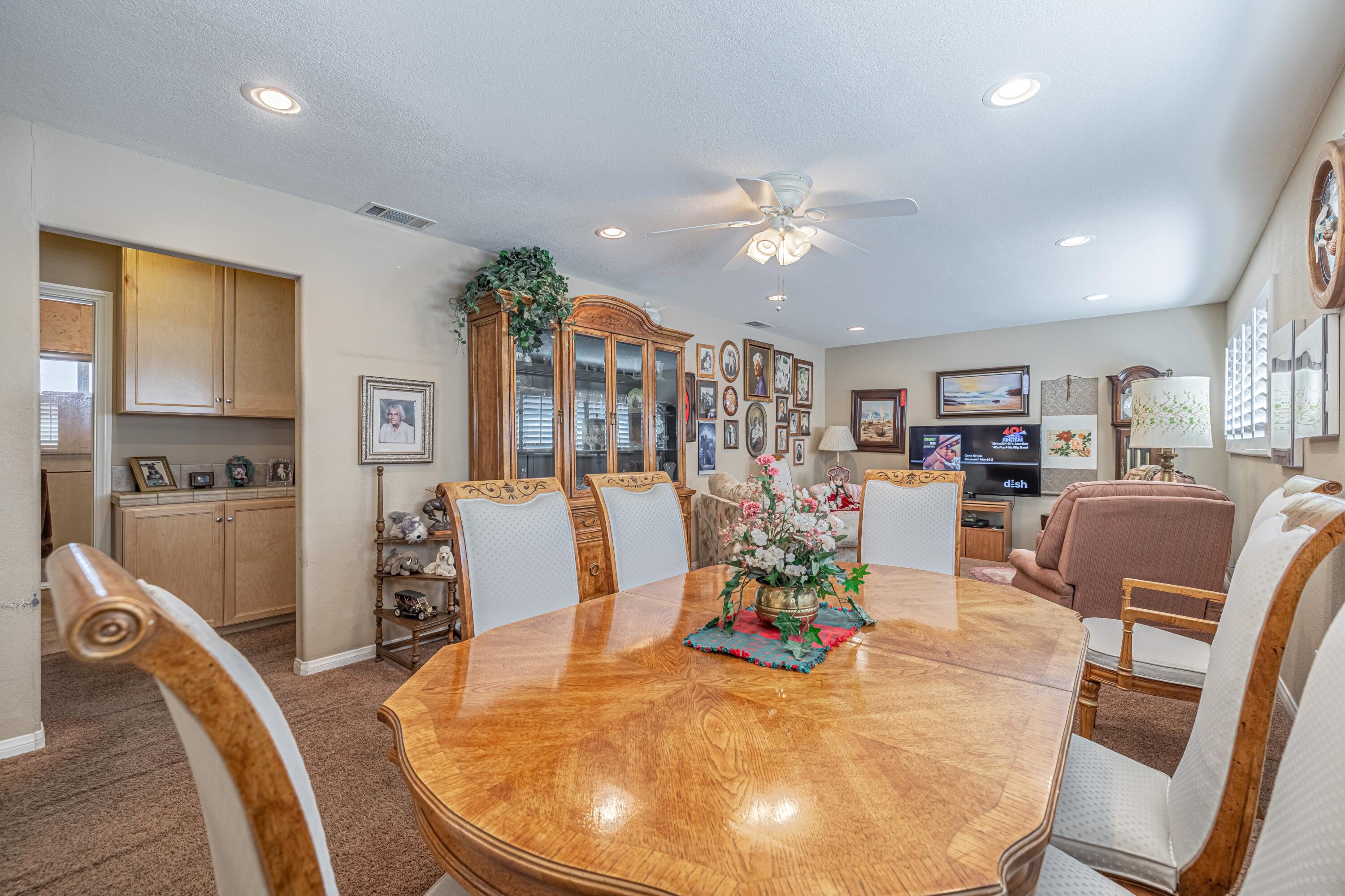 2153 West Ave K8 Lancaster, CA 93534 - Photo 15 of 31 a view of a dining room kitchen with furniture and wooden floor