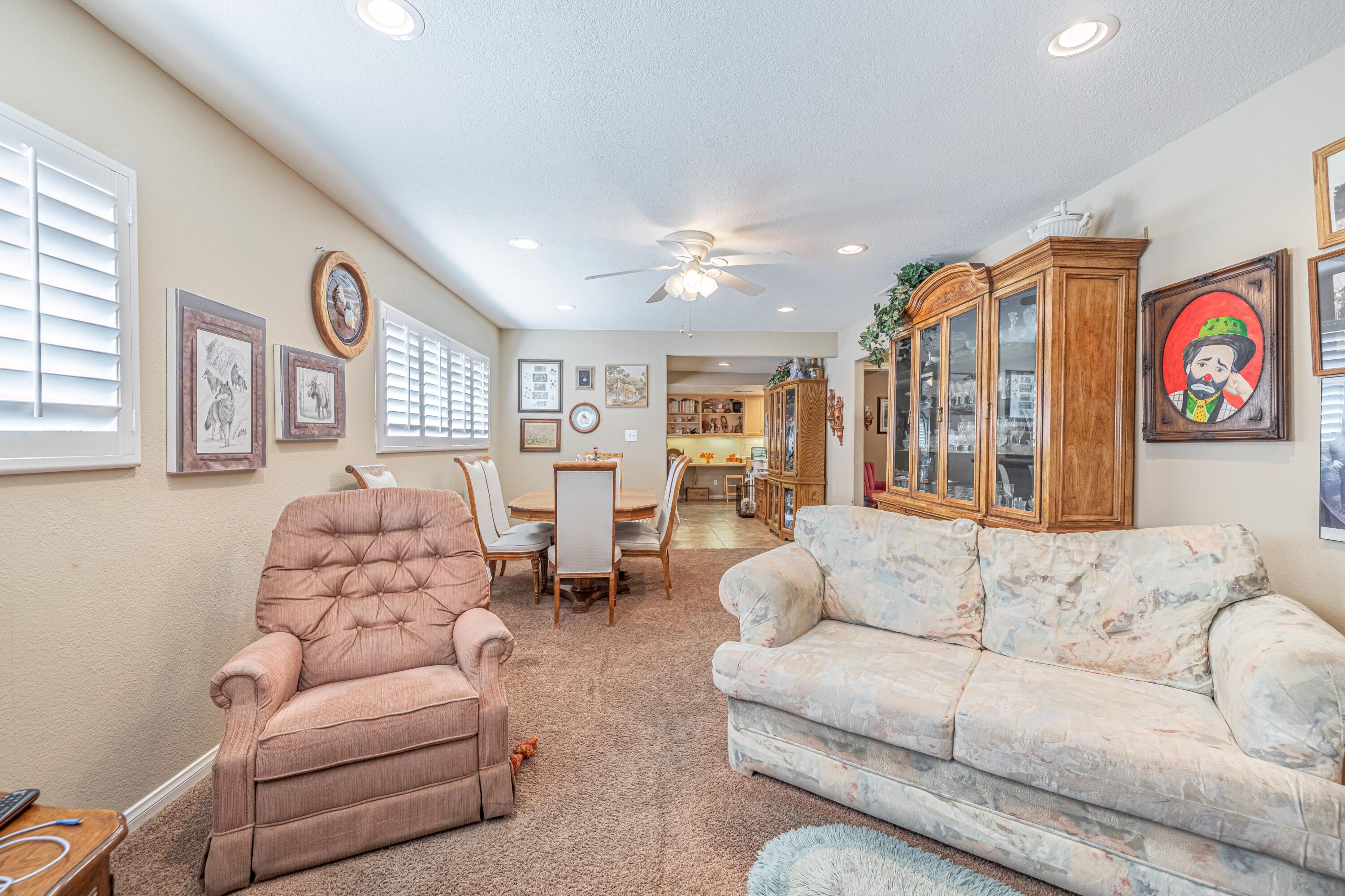 2153 West Ave K8 Lancaster, CA 93534 - Photo 17 of 31 a living room with furniture kitchen view and a large window