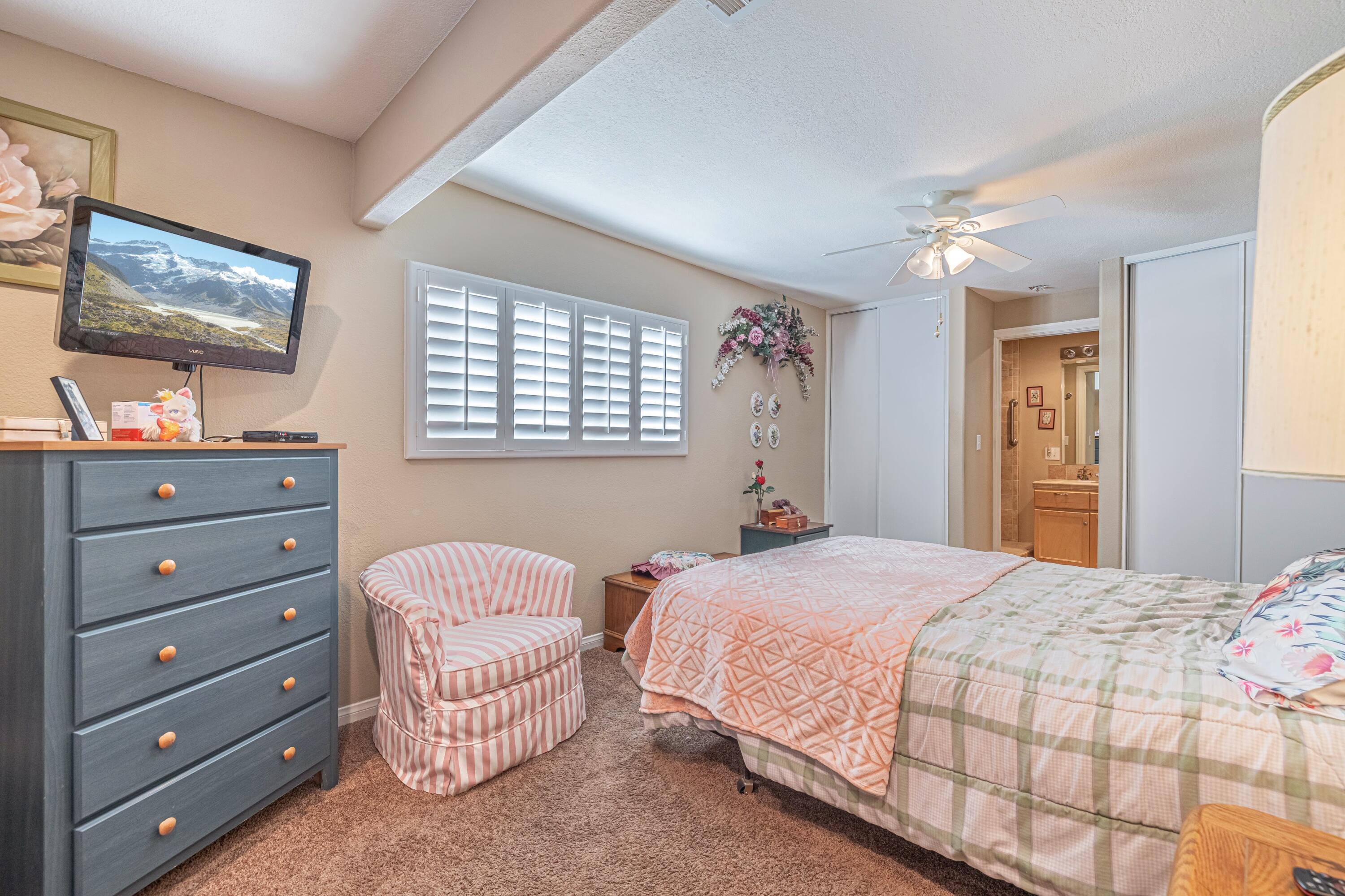2153 West Ave K8 Lancaster, CA 93534 - Photo 18 of 31 a bedroom with a bed and a dresser