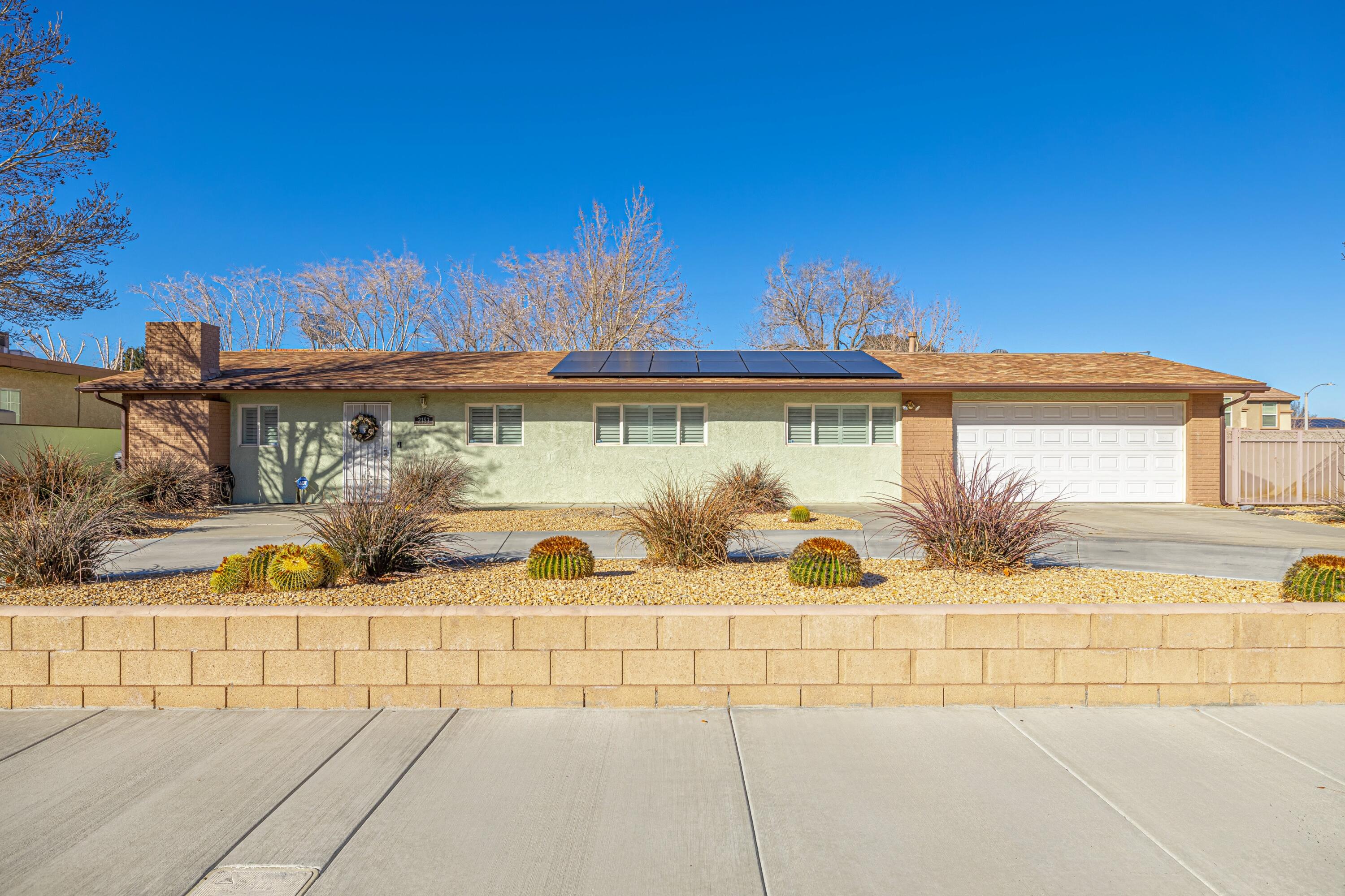 2153 West Ave K8 Lancaster, CA 93534 - Photo 2 of 31 a view of a balcony with potted plants