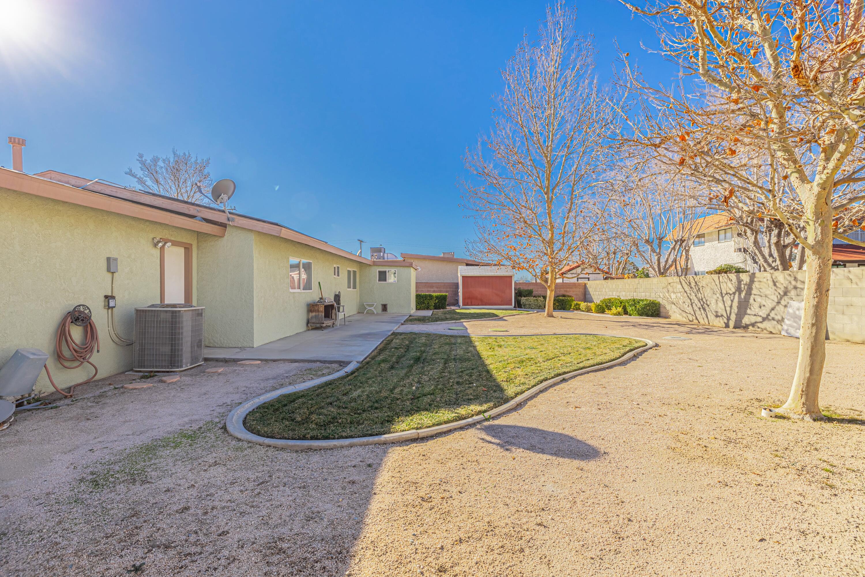 2153 West Ave K8 Lancaster, CA 93534 - Photo 28 of 31 a view of a back yard of the house