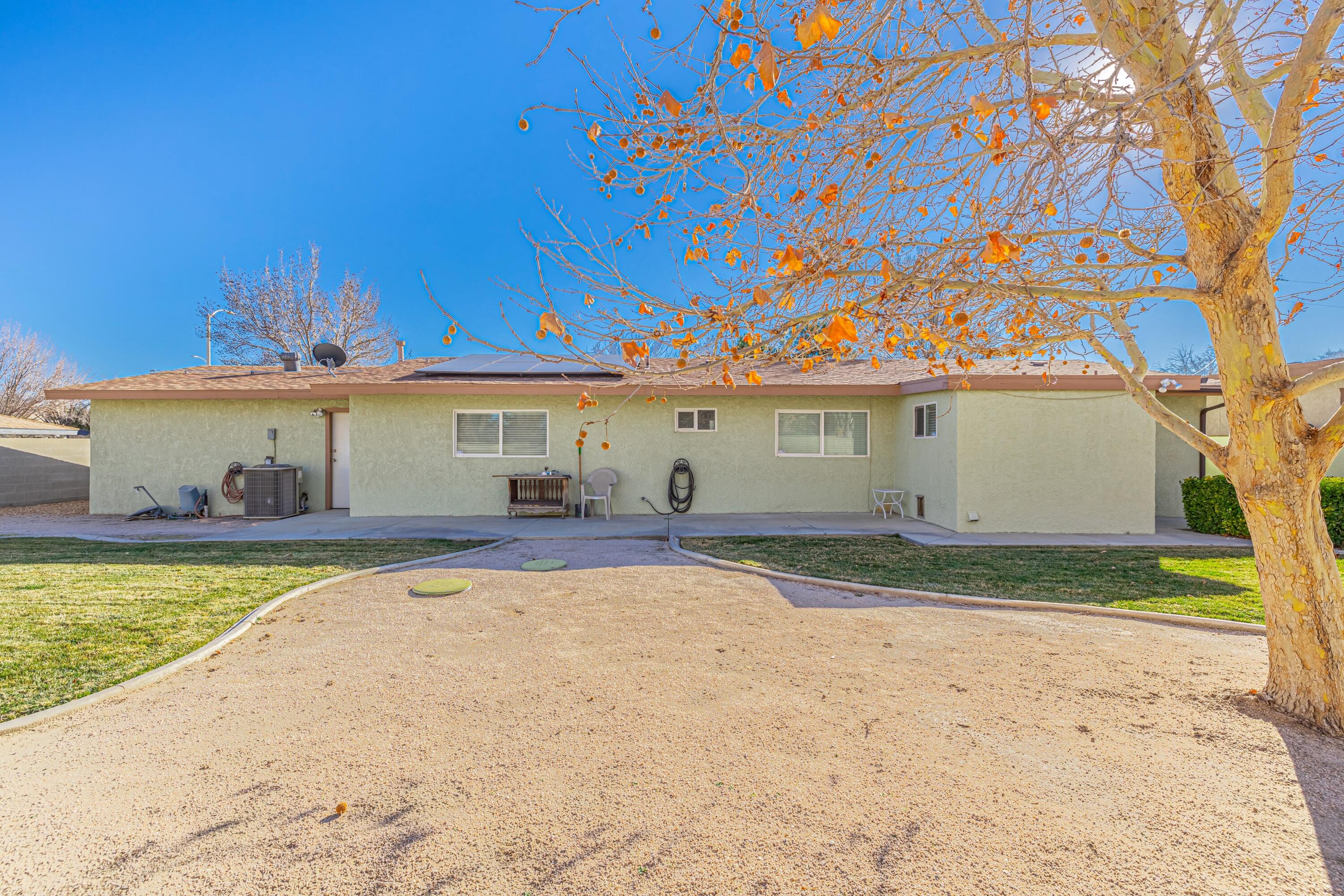 2153 West Ave K8 Lancaster, CA 93534 - Photo 29 of 31 a front view of a house with a yard and a garage
