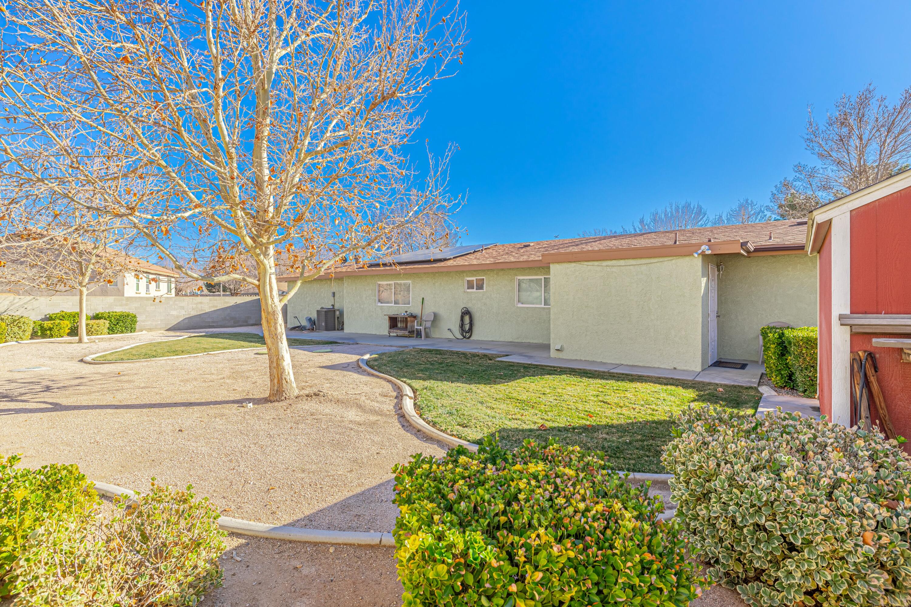 2153 West Ave K8 Lancaster, CA 93534 - Photo 30 of 31 a view of a backyard of the house