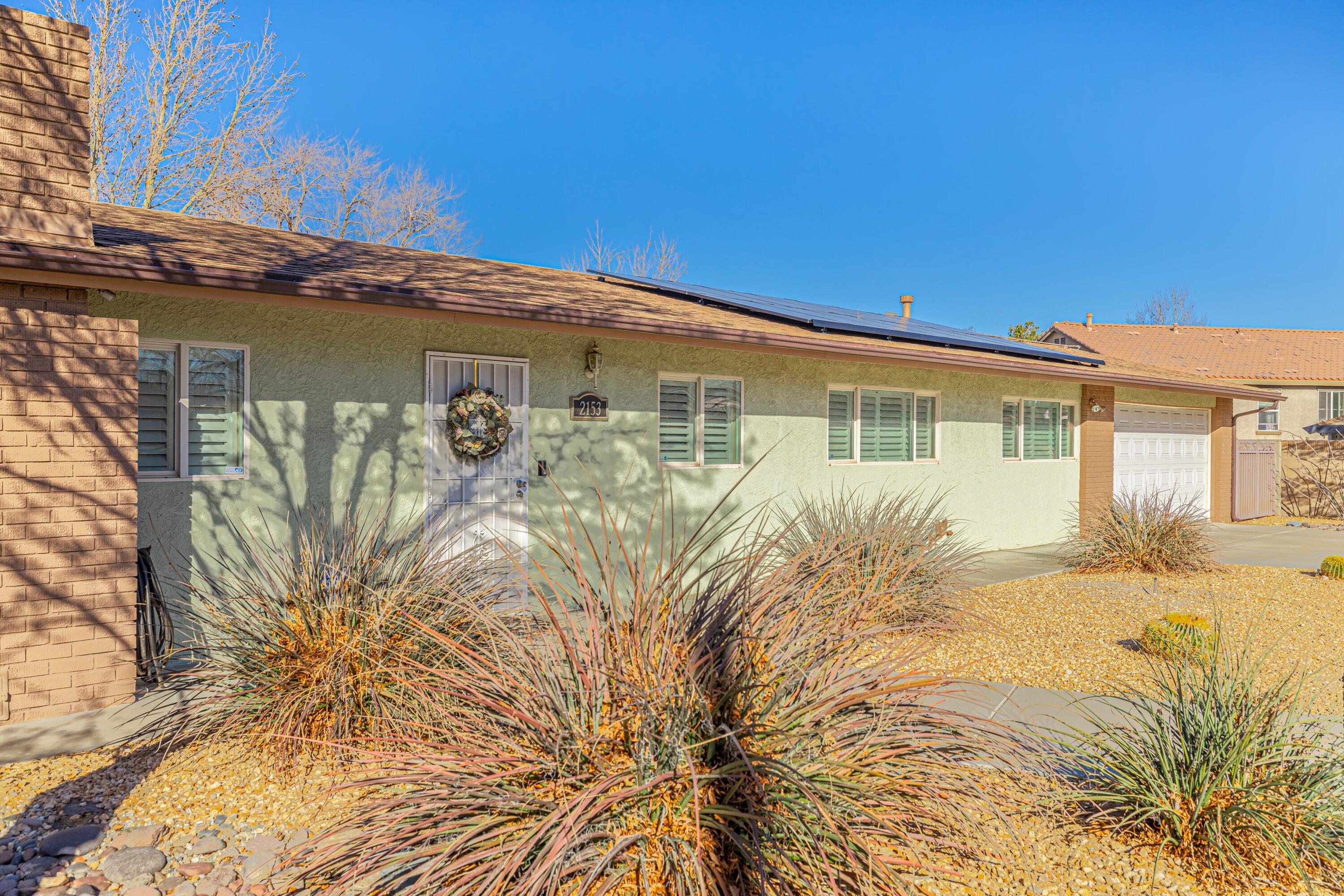 2153 West Ave K8 Lancaster, CA 93534 - Photo 4 of 31 a front view of a house with garden