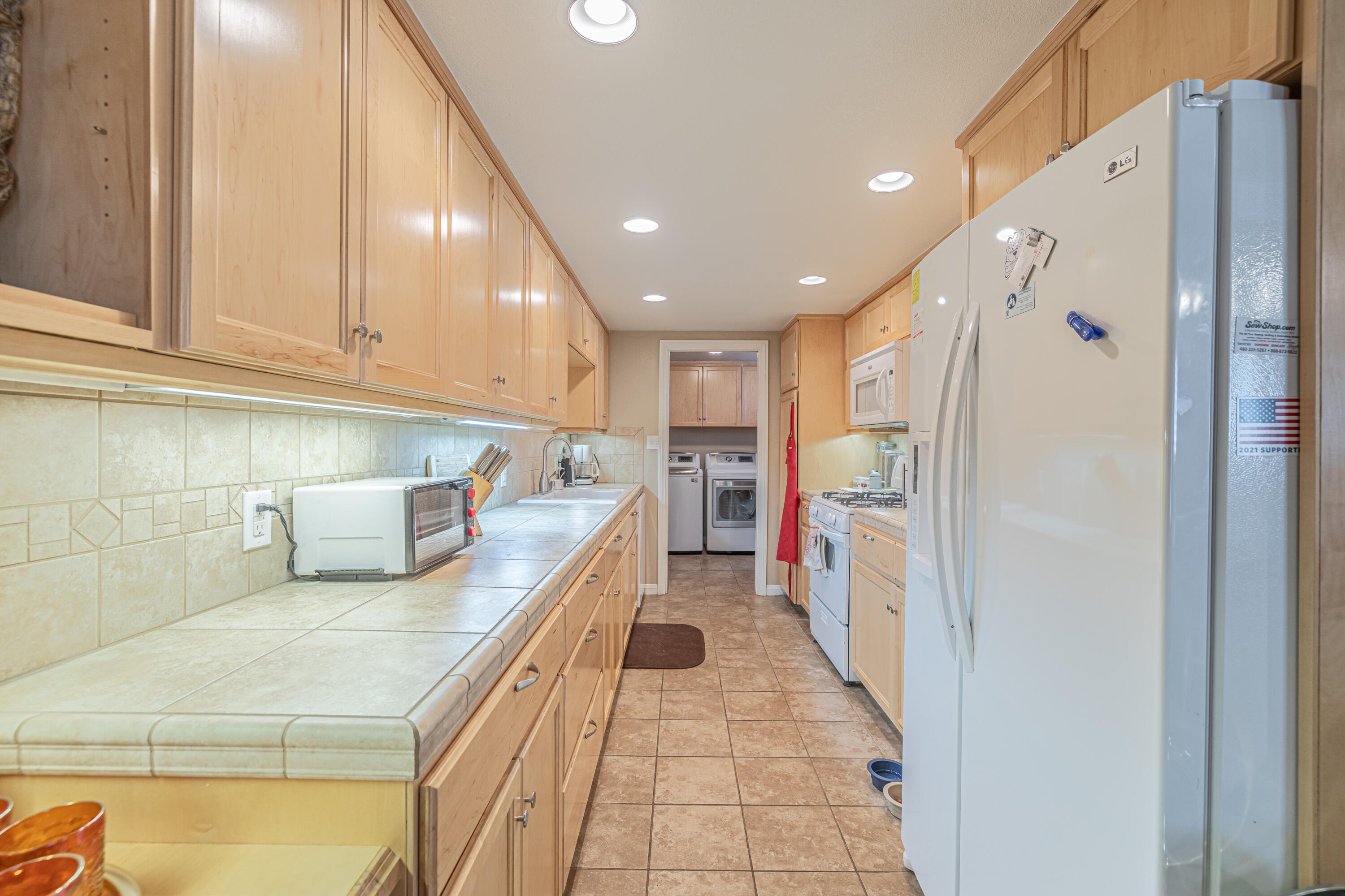 2153 West Ave K8 Lancaster, CA 93534 - Photo 9 of 31 a kitchen with stainless steel appliances granite countertop a refrigerator and a sink